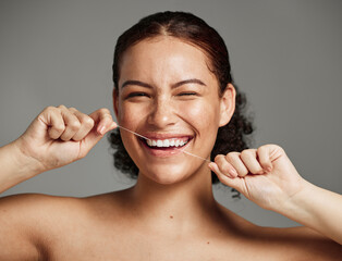 Dental floss, flossing teeth and woman with a smile for oral hygiene, health and wellness on studio...