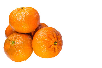 Stack of tangerine or mandarin fruits isolated on white background with copy space. Close up.