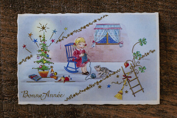Old retro french postcard with the words Bonne Annee what is translated Happy New Year in French....