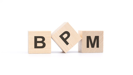 BPM - acronym from wooden blocks with letters, Business Process Management concept, top view on white background
