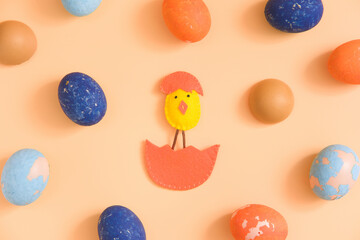 Diy easter chicken in eggshell. concept. beige background. layout
