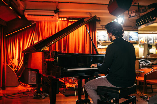 Man playing piano in a club
