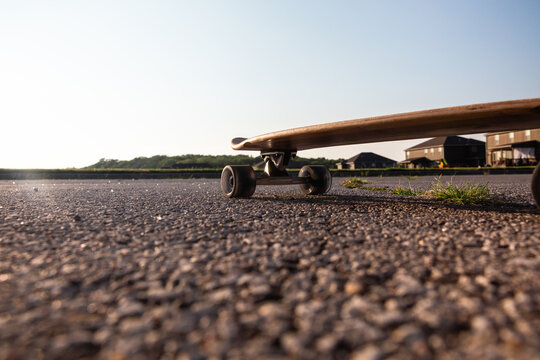 Empty longboard on asphalt 