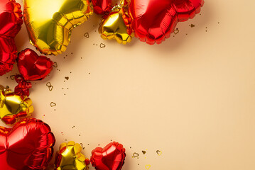 Valentine's Day concept. Top view photo of heart shaped red golden balloons and glowing confetti on...
