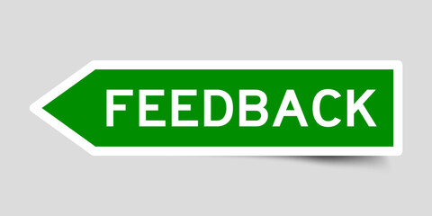 Green color arrow shape sticker label with word feedback on gray background