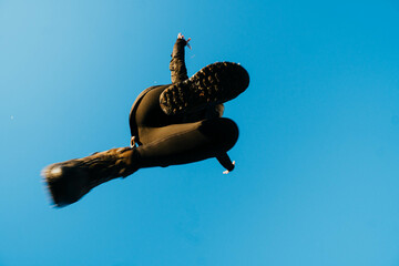 nadir photography of woman jumping against blue sky - obrazy, fototapety, plakaty