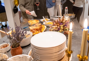 Decorated New Year's table with golden candles