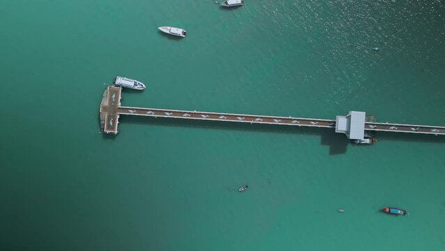 aerial view of pier,top view,people walking along pier