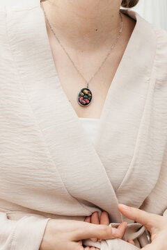 woman wearing floral epoxy necklace 