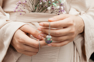 woman wearing floral epoxy necklace 