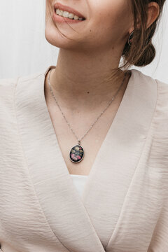 woman wearing floral epoxy necklace 