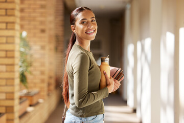 Woman portrait, university student and college books and water bottle while walking at campus with a smile. Gen z female happy about education, learning and future after studying at school building - obrazy, fototapety, plakaty