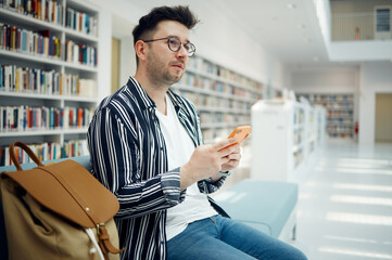 Smartphone, library and student with university idea, knowledge or mindset for education, college...