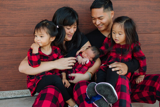 Parents with arms full