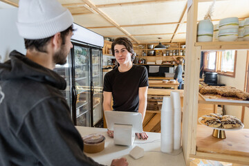 An Employee Talks With Customer