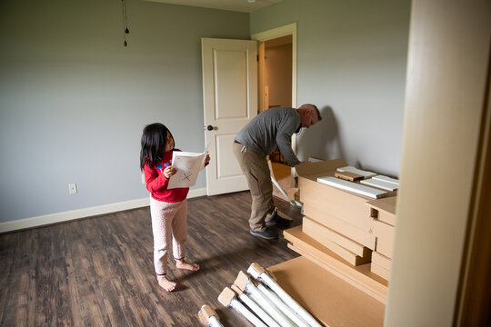 Father and daughter organizing building project