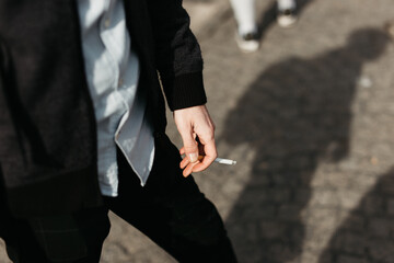 Men`s hand and a cigarette