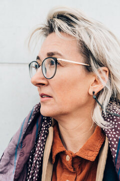 A Mature Woman Walking Outdoors In The Sity