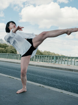 Woman doing the dancing moves on the street
