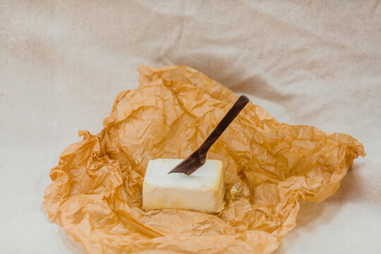 Vegan, artisan butter with wooden knife