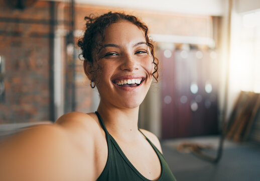 Fitness portrait, exercise and gym selfie of a woman happy about workout, training motivation and body wellness. Young sports female or athlete with a smile on social media blog for healthy lifestyle