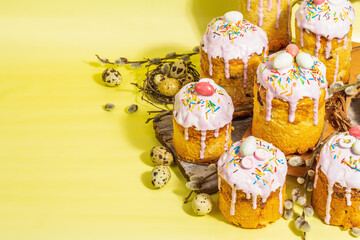 Traditional Easter cake. Festive sweet food with icing and decor. Eggs, nest, willow