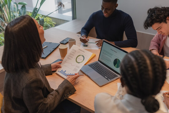 Businesswoman laughing at joke of colleague