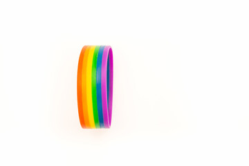 Rainbow patterned wristband on a white background