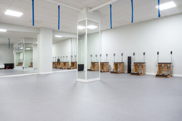 Pilates chairs near wall in studio