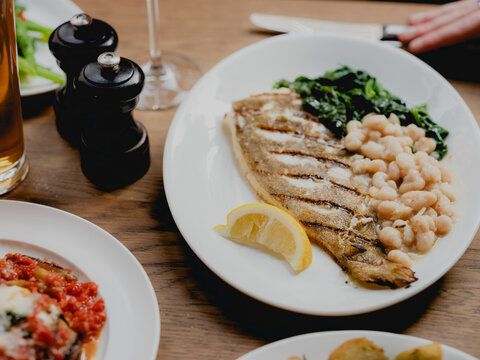 Sea bass with beans and spinach 