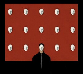 Man hides his face under one of his masks