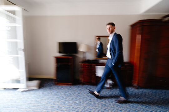 Groom hotel room wedding day 