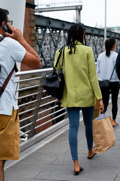  Unrecognisable group walking with shopping bag