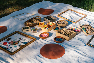 Various items with frames on blanket during art class