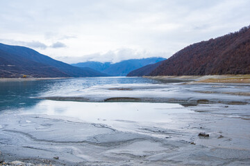 Ananuri, Georgia : 20-11-2022 : Landscape of  Aragvi River next to the  Ananuri castle complex, close Tblisi, Georgia, . It is a dry river in  a cloudy day in winter