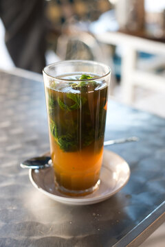 A glass of traditional Moroccan mint tea at a cafe in Asilah, Morocco.