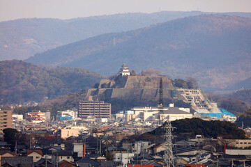 A rusty trash can in the park