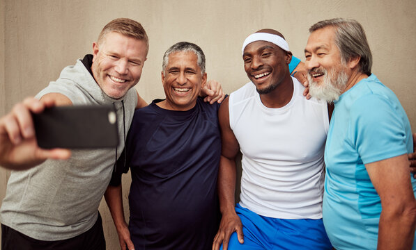 Happy men, phone selfie and exercise group with motivation of fitness on wall background. Smile, sports and male friends taking photograph together in community workout, wellness support or diversity