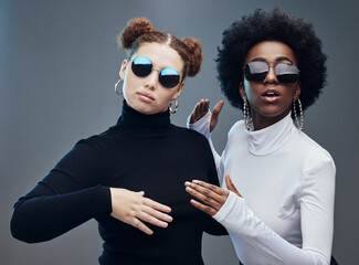 Fashion, women with sunglasses and futuristic with robotics, cyberpunk and trendy. Future design,...