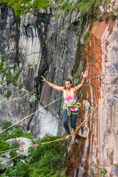 Young woman balancing on slackline, Dibs Quarry, Maripora, Sao Paulo State, Brazil