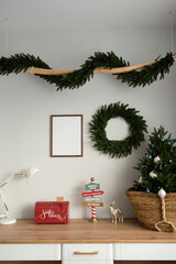 Mockup of a wooden frame in the interior of a room decorated for Christmas