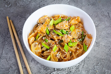 Noodles with vegetables, chicken and mushrooms in bowl. Stir fry pasta