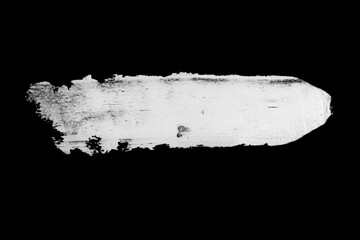 Abstract cream stroke of white paint. Raw thick white color dye imprint. Isolated on black...