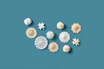 Paper New Year baubles on blue background.