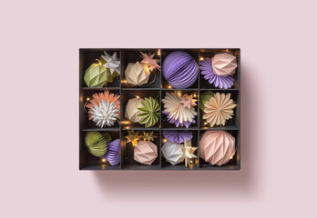 Present box with baubles and Christmas lights.