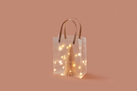 Bag with paper tree decorated with garland.