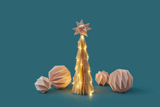 Paper ornaments and Christmas tree with lights.