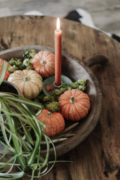 decorative fall gourds in a handmade wood bowl
