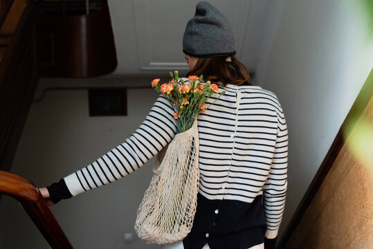 Stylish Woman With Flower In Shopping Bag