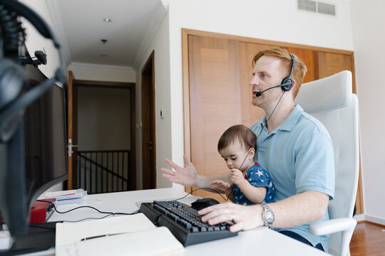 Dad working from home with a toddler